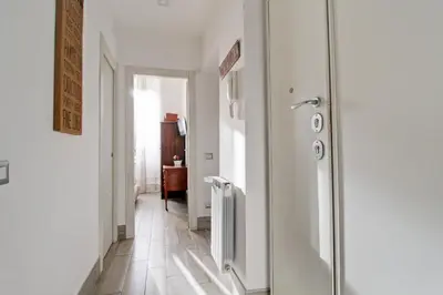 a hallway with a refrigerator in a room at Si.Ca.Li. al Vaticano in Rome