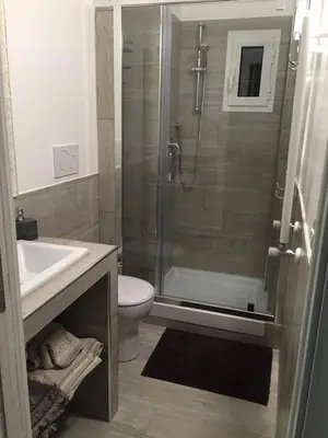 a bathroom with a shower and a toilet and a sink at Si.Ca.Li. al Vaticano in Rome