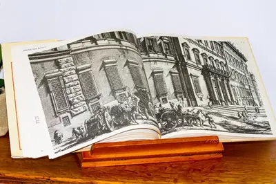 an open book sitting on a wooden table at Si.Ca.Li. al Vaticano in Rome