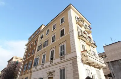 a building with a clock on the side of it at Si.Ca.Li. al Vaticano in Rome