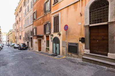 a building with a wooden door on the side of it at Purificazione 44 Guest House in Rome