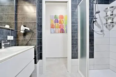 a bathroom with a shower and a sink at Valery Guest House in Rome