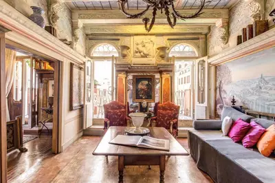 a living room with a couch and a table at Campo De Fiori Baroque in Rome