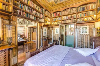 a ceiling of a building with a painting on it at Campo De Fiori Baroque in Rome