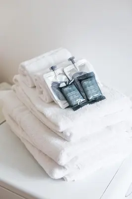 a pile of towels sitting on top of a table at Xystum in Rome