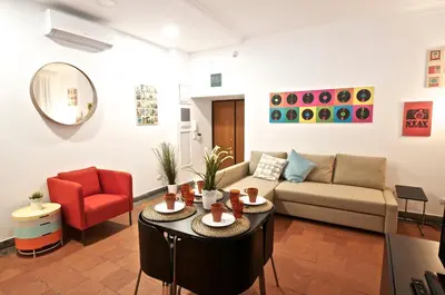 a living room with a couch and a table at Flaminio Butterfly House in Rome