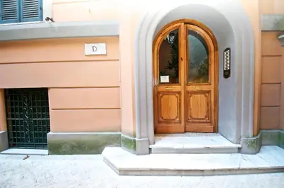 a wooden door on the side of a building at Flaminio Butterfly House in Rome