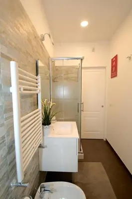 a bathroom with a sink and a shower and a toilet at Flaminio Butterfly House in Rome