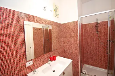 a bathroom with a sink and a mirror at Flaminio Butterfly House in Rome