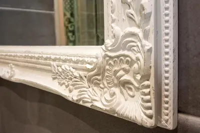 a white frame on a window with a mirror at Roma 2B in Rome