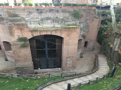 a large brick building with a large door at Roma 2B in Rome
