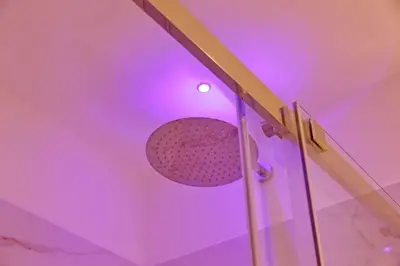 a microphone in a room with purple lights at Alla Locanda Malandra in Rome