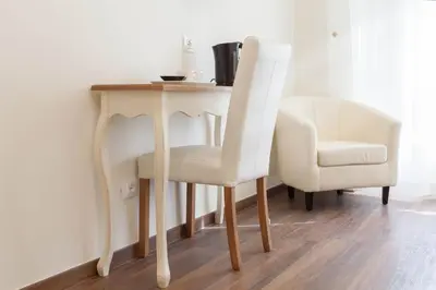 a table and two chairs sitting next to a table at Donna Margherita Rome Suite & Rooms in Rome