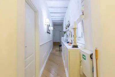 a hallway with white walls and a white door at StarHome Pantheon in Rome