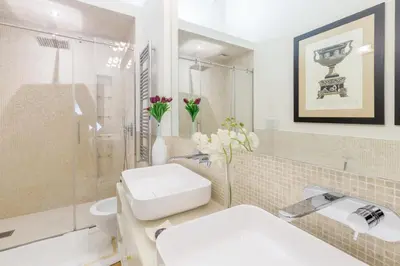 a bathroom with a sink and a toilet and a mirror at StarHome Pantheon in Rome
