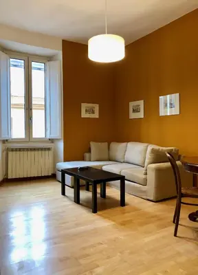 a living room with a couch and a coffee table at Monti Friendly Rome House in Rome