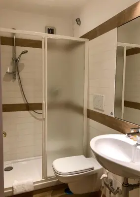 a bathroom with a shower and a toilet and a sink at Monti Friendly Rome House in Rome