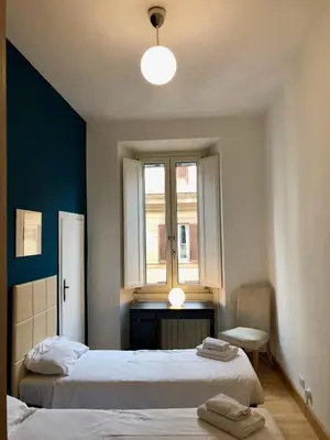 a bedroom with two beds and a window at Monti Friendly Rome House in Rome