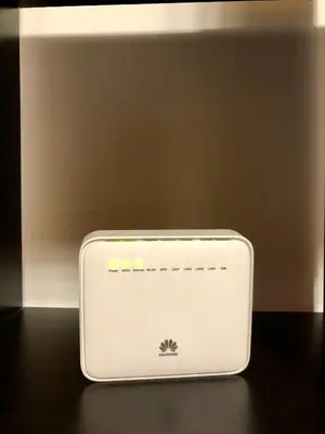 a white modem sitting on top of a table at Monti Friendly Rome House in Rome