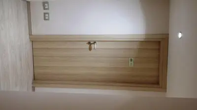 a wooden door in the corner of a room at Romulea Guest House in Rome