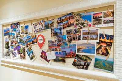 a collage of photos on a wall at La Casa di Emma a Trastevere in Rome
