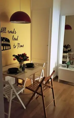 a dining room with a table and two chairs at Jubilee 2 in Rome