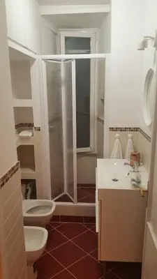 a bathroom with a shower and a toilet and a sink at Jubilee 2 in Rome