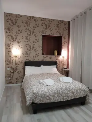 a bedroom with a bed with towels on it at Appia 52 in Rome