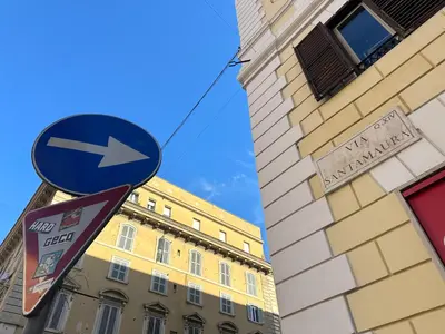a blue street sign in front of a building at Candia41 in Rome