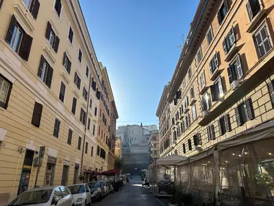 a city street with buildings and cars parked on the street at Candia41 in Rome