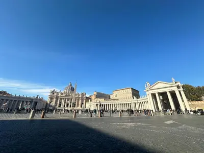 a group of buildings with people standing in a courtyard at Candia41 in Rome
