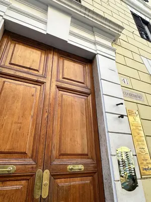 a wooden door on the side of a building at Candia41 in Rome