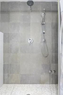 a shower with a shower head in a bathroom at Relais Incantesimo Vaticano in Rome