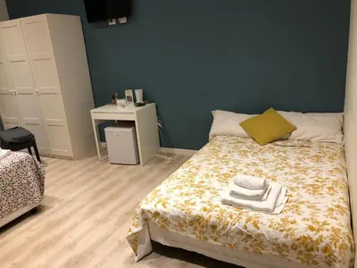 a bedroom with a bed with towels on it at Spazio Cavour Guesthouse in Rome