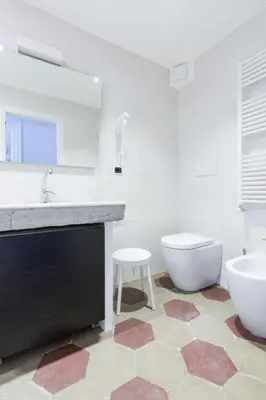 a bathroom with a sink and a tub and a toilet at Relax Apartment Zanardelli, Piazza Navona in Rome