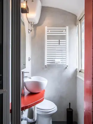 a bathroom with a white sink and a toilet at Tetti di Piazza Navona in Rome