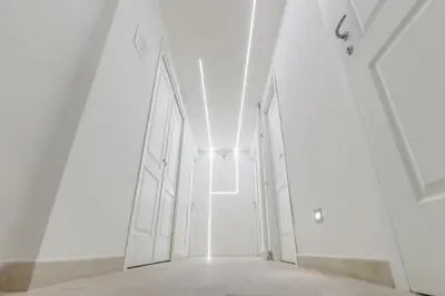 an empty corridor in a building with white walls and ceilings at Mr. Charlie Brown in Rome