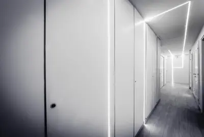an empty corridor with white walls and wooden floors at Mr. Charlie Brown in Rome
