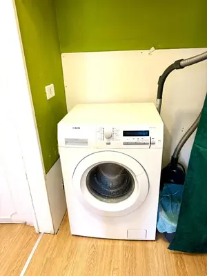 a washing machine in the corner of a room at Angelico 90 in Rome