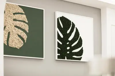 two pieces of art hanging on a wall at Vaticano Luxury Guest House in Rome