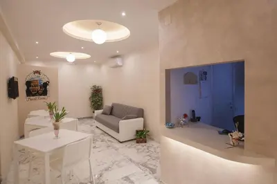 a living room with a couch and a table at B&B Momenti Romani in Rome