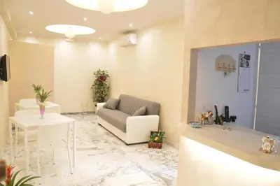 a living room with a couch and a table at B&B Momenti Romani in Rome