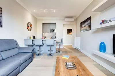 a living room with a couch and a table at Vatican Guest House in Rome
