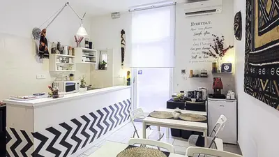 a kitchen with a counter and a table and chairs at Magic Double in Rome