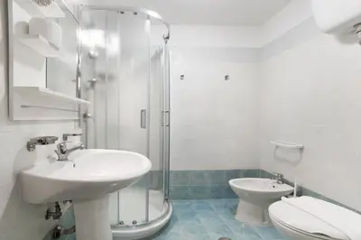 a bathroom with a sink and a toilet and a shower at Magic Double in Rome