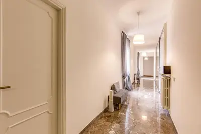 a hallway with a door leading into a room at YH SUITE 131 in Rome