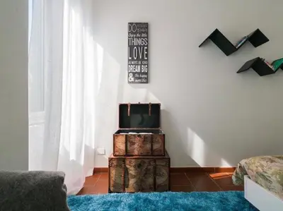 a room with a pile of luggage on top of chests at Garibaldi Roof Garden in Rome