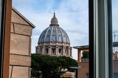 a view of a domed building from a window at Vatican Balcony in Rome