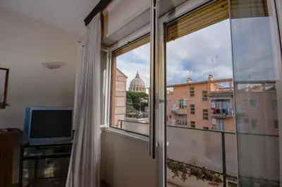 a room with a window with a view of a building at Vatican Balcony in Rome