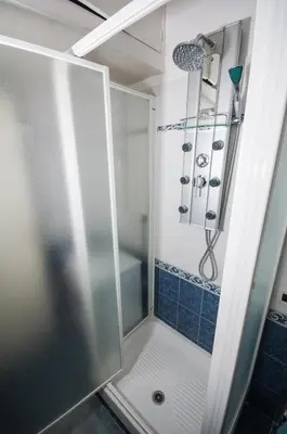 a shower with a glass door in a bathroom at Vatican Balcony in Rome